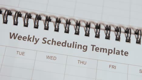 Opening-Notepad-to-reveal-'Weekly-Scheduling-Template'-Text-Heading