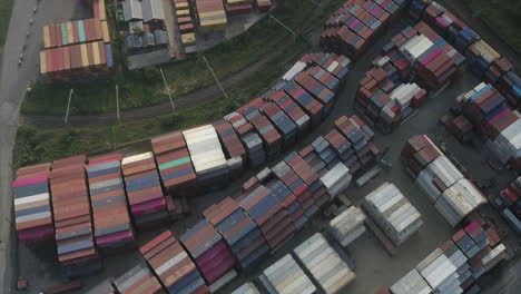 Aerial-drone-shot-over-two-shipping-container-yards