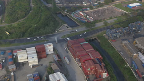 Wide-aerial-shot-of-trucks-leaving-a-shipping-container-yard-in-South-Africa