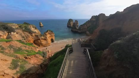 The-breathtaking-beauty-of-the-beaches,-cliffs,-waves,-and-sea-in-the-Lagos-region-of-Portugal,-particularly-in-the-Ponta-da-Piedade-area,-is-truly-stunning