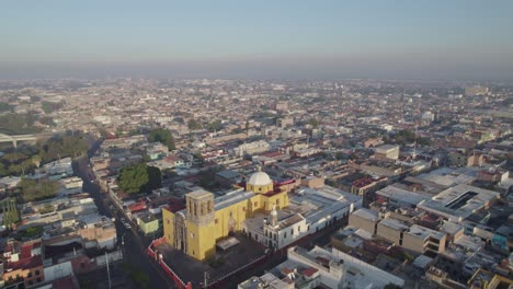 Aerial-shot-at-dawn-of-the-old-parish-in-Salamanca-Guanajuato