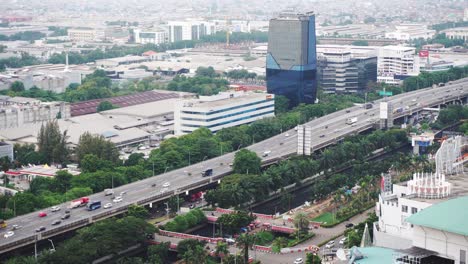 Still-shot-of-Jakarta-city,-showing-a-highway-with-slow-traffic