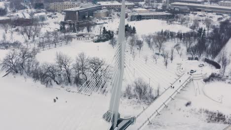 Walking-bridge-in-winter-over-the-red-river