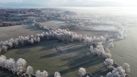 Aerial-footage-moving-forwards-over-a-hoar-frost-on-Dedham-vale-with-the-River-Stour-in-the-early-morning