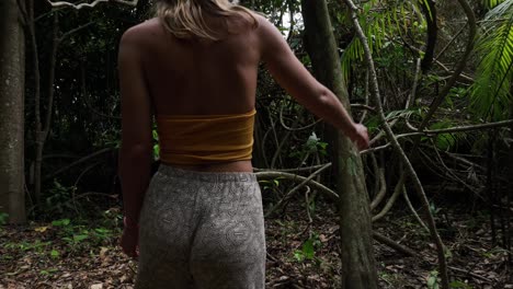 Traveler-woman-walking-through-the-tropical-rain-jungle-forest