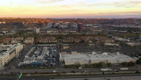 Drone-flight-at-sunrise-in-Mission-Valley,-San-Diego-California