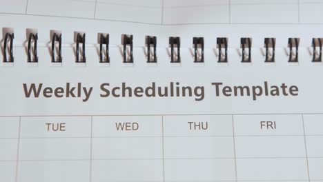 Revealing-text-'Weekly-Scheduling-Template'-by-opening-Notepad
