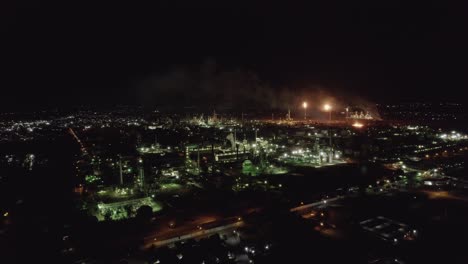 Aerial-shot-of-a-refinery-on-a-polluted-night