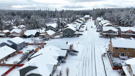 Aerial-view-of-a-suburban-middle-class-neighborhood-covered-in-snow