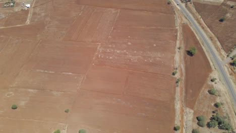 Beautiful-aerial-of-dry-agricultural-farmlands-in-rural-Kenya