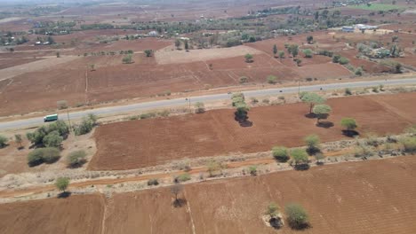 High-angle-view-of-traffic-driving-over-highway-in-rural-Kenya