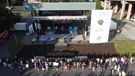Aerial-Shot-of-a-crowd-of-people-gathered-to-a-music-concert