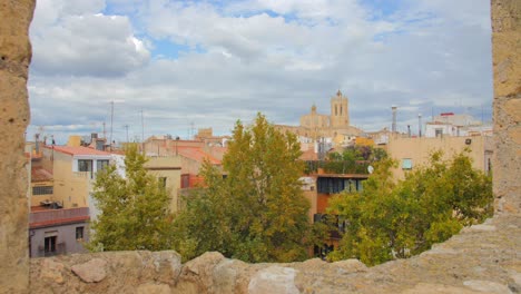 The-cityscape-of-Tarragona,-Catalonia-captured-from-the-remains-of-the-medieval-castle-on-a-cloudy-day-making-the-scene-appear-like-painting