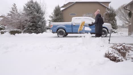 Senor-woman-shoveling-snow-after-a-storm