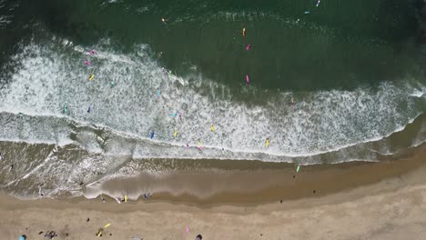 Aerial-shot-of-surfers-in-the-Pacific-Ocean