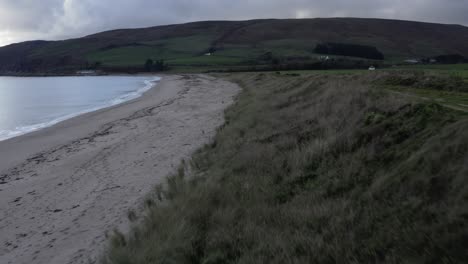 AERIAL---Southend-beach-in-Kintyre-Peninsula,-Scotland,-pan-left