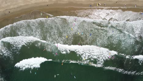 Aerial-shot-of-surfers-in-the-Pacific-Ocean