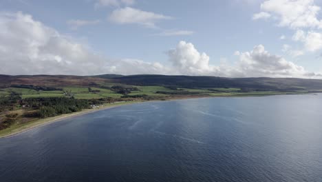 AERIAL---A-beautiful-day-in-Point-Sands-beach,-Mull-of-Kintyre,-Scotland,-reverse