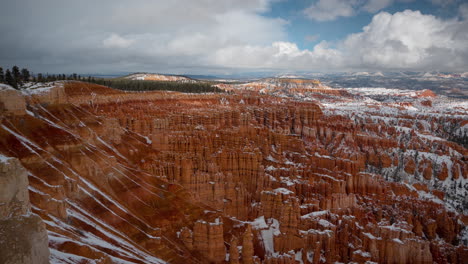 Timelapse-of-Bryce-Canyon-National-Park-on-Winter-Season,-Clouds-and-Shadows-on-Red-Rock-Sandstone-Cliffs-and-Amphitheater,-Utah-USA