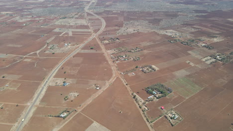 High-angle-pan-of-farms-and-houses-in-a-beautiful-Kenyan-landscape