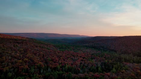 Aerial-drone-video-footage-of-the-beautiful-appalachian-mountains-during-peak-foliage-in-new-york's-hudson-valley-during-golden-hour