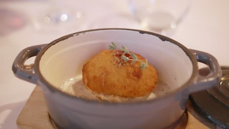 Delicious-Spanish-Croquette-In-Truffle-Sauce-Served-In-A-Ceramic-Bowl-At-Gourmet-Restaurant