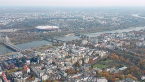 Aerial-panorama-Warsaw-City-Buildings-Vistula-River-and-Narodowy-Stadium,-Poland
