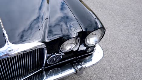 Old-black-american-car-headlights,-old-american-muscle-car,-desoto-diplomat,-car-shiny-headlights,-american-car-hood,-black-car