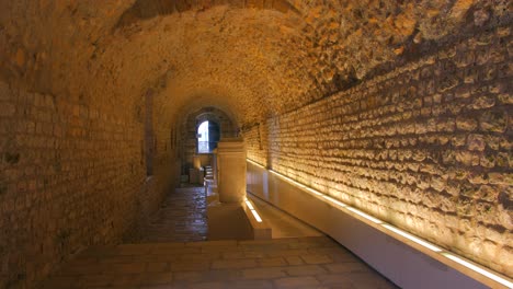 View-of-a-narrow-corridor-situated-inside-of-the-Circo-Romano-in-Spanish-city-Tarragona---handheld-shot
