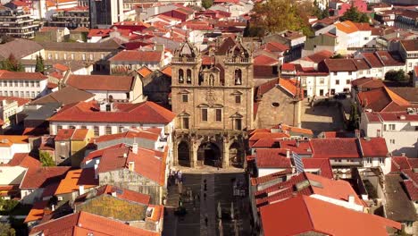 Aerial-zoom-out-of-braga-Portugal-old-town-city-center-famous-travel-destination