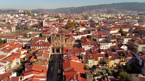 Drone-fly-above-brava-old-town-city-center-ancient-capital-of-Portugal-during-a-sunny-day