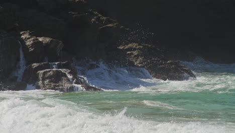 Waves-Crashing-On-Rugged-Coastal-Cliff-With-Backwash