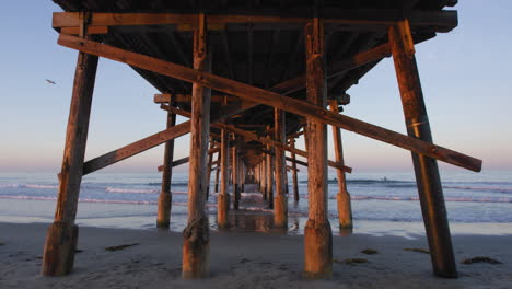 Underneath-The-Newport-Beach-Pier-At-Sunrise---Fishing-Pier-In-Newport-Beach,-California