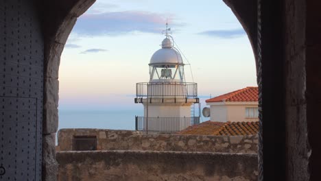 Peniscola-Lighthouse-As-Seen-From-The-Arched-Balcony-In-The-Old-Peniscola-Town,-Castellon,-Spain