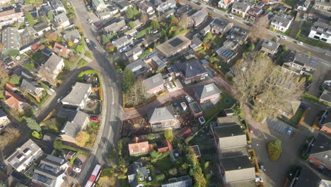 Aerial-of-new-houses-with-solar-panels-on-rooftop-in-an-older-suburban-neighborhood