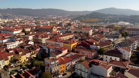 Aerial-panoramic-view-of-braga-old-town-city-historical-center-during-sunny-day,-drone-fly-above-Portugal