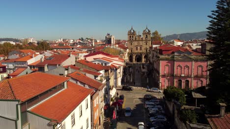Braga-Portugal,-drone-fly-above-city-center-old-town-historical-quarter,-aerial-zoom-in-famous-cathedral-travel-destination