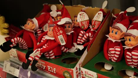 Tiny-Christmas-holiday-season-gift-naughty-elf-toy-doll-on-retail-department-store-shelf