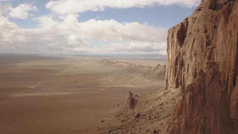 drone-shot-flying-close-by-looking-over-the-beautiful-landscape-around-Shiprock,-Navajo-New-Mexico-USA-in-4k