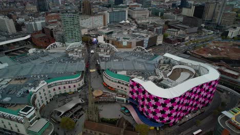 Sweeping-aerial-view-over-the-Bull-Ring-Mall-and-New-Street-Rail-Station-of-Birmingham-City-centre