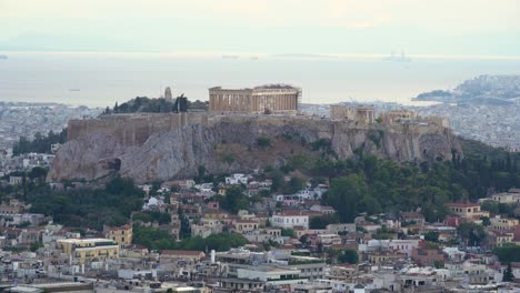 Beautiful-landscape-Acropolis-of-Athens-with-Plaka-Village-on-Hillside,-Greece