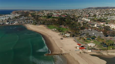 Rotating-aerial-view-over-Doheny-State-Beach-in-Dana-Point,-California
