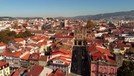 Drone-fly-above-city-center-old-town-braga-north-Portugal-during-a-sunny-day-of-summer-travel-destination-touristic-spot