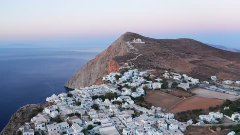 Aerial-panoramic-view-Beautiful-typical-white-houses-City-Landscape-at-Sunset,-Greece