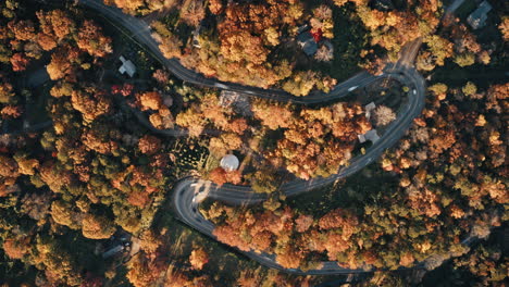 Static-aerial-drone-timelapse-of-a-curve-in-the-road-on-Signal-Mountain-during-autumn