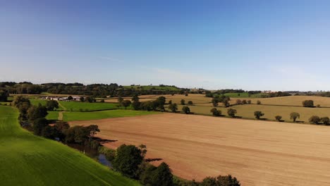 Aerial-Over-Idyllic-Patchwork-East-Devon-Farmland-Countryside-Near-Honiton