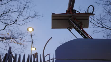 Electric-bus-receiving-renewable-electricity-at-the-bus-station-at-dusk