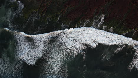 Top-Down-Aerial-View,-Pacific-Ocean-Waves-Breaking-on-Shore-at-Golden-Hour-Sun