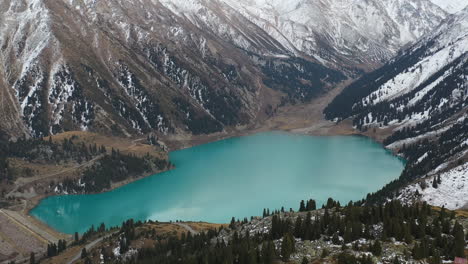 Cinematic-rotating-drone-shot-of-the-Big-Almaty-Lake-in-the-Trans-Ili-Alatau-mountains-in-Kazakhstan