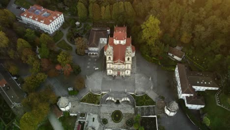 Aerial-drone-footage-braga-Portugal-sanctuary-Christian-cathedral-Jesus-do-Monte-in-the-evergreen-forest